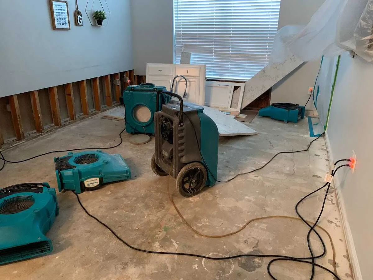 Dehumidifier in flood-cut room for Water Damage Restoration in Ashland